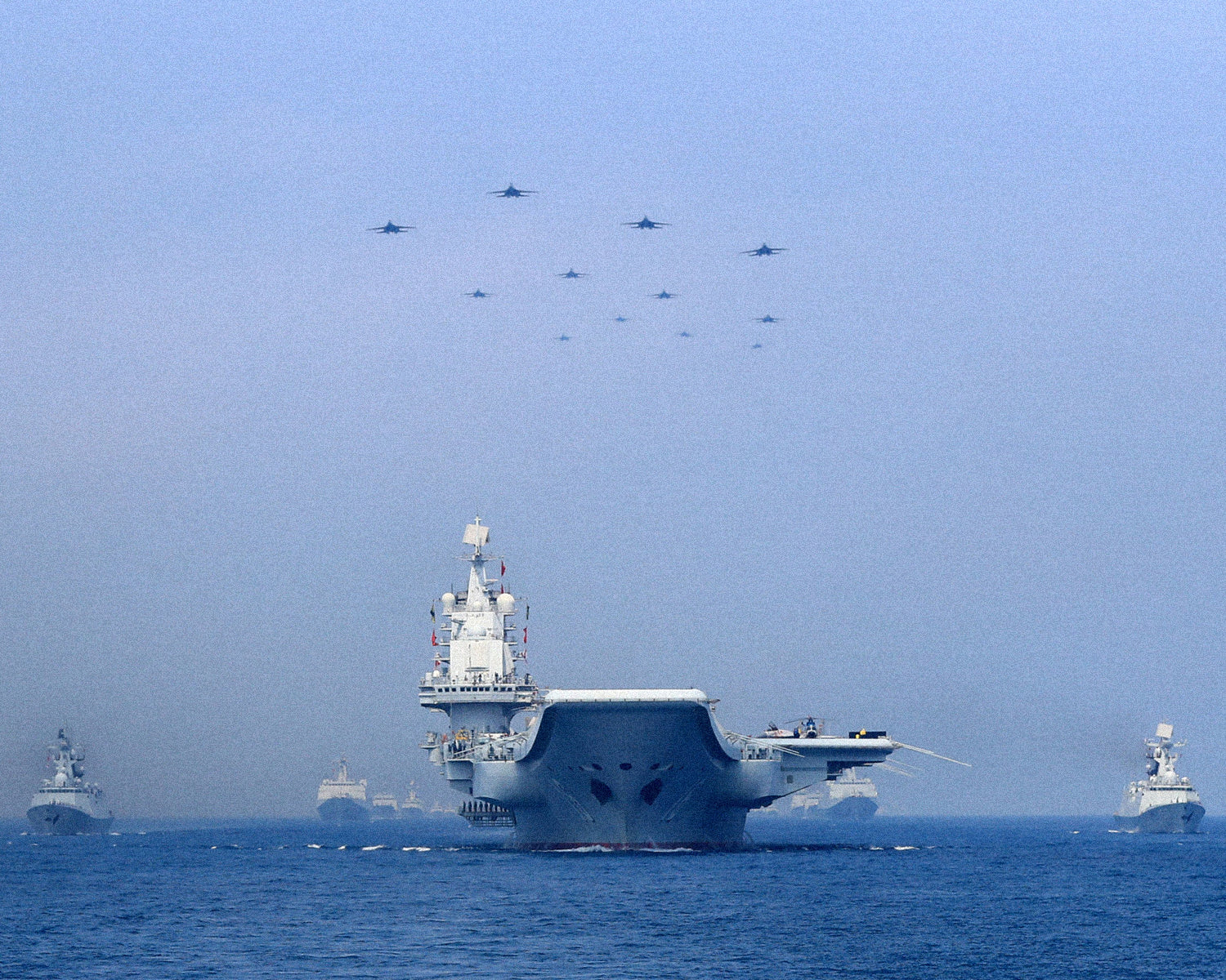 China massing warships across region in largest show of force yet