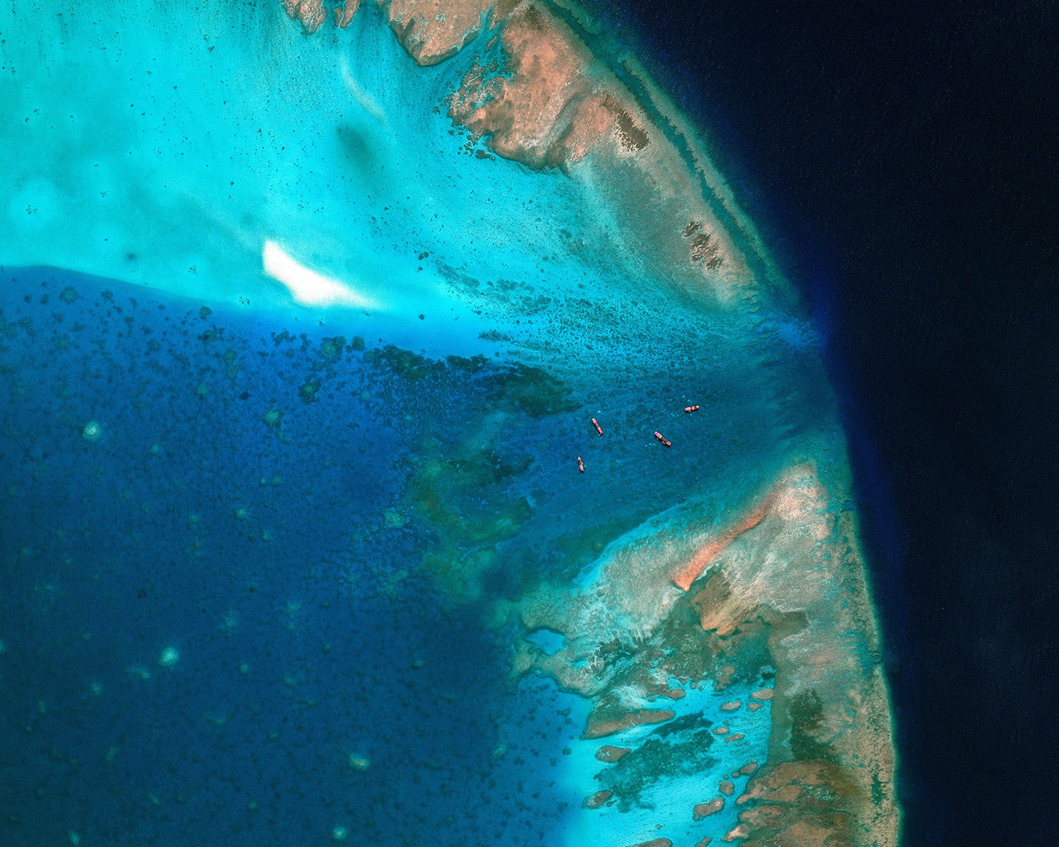 China moves to block entrance to disputed South China Sea shoal, images show