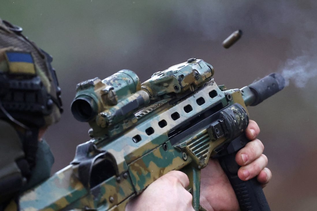 A member of the Ukrainian special forces zeroes his weapons prior to a mission