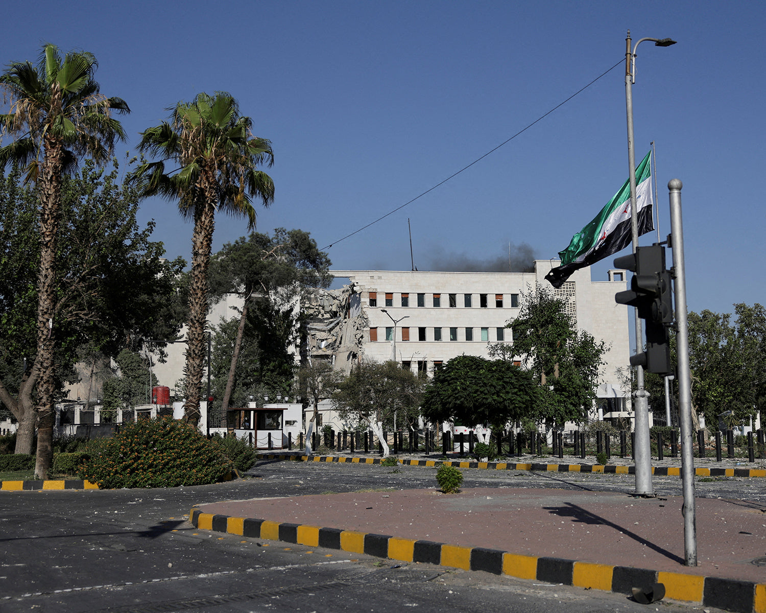 Israel's attacks on Damascus hinder Assad chemical weapons search, Syrian official says