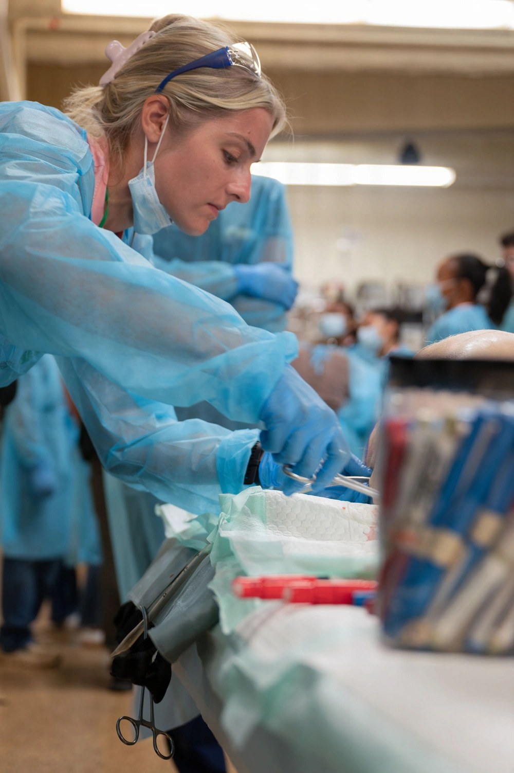 U.S. Air National Guard 2nd Lt. Cathrine Carlin prepares to insert a chest tube into a training specimen during Armed Forces Advanced Trauma Training at Marine Corps Base Hawaii on Aug. 20, 2026. U.S. Air National Guard photo by Staff Sgt. Alancea Grant.