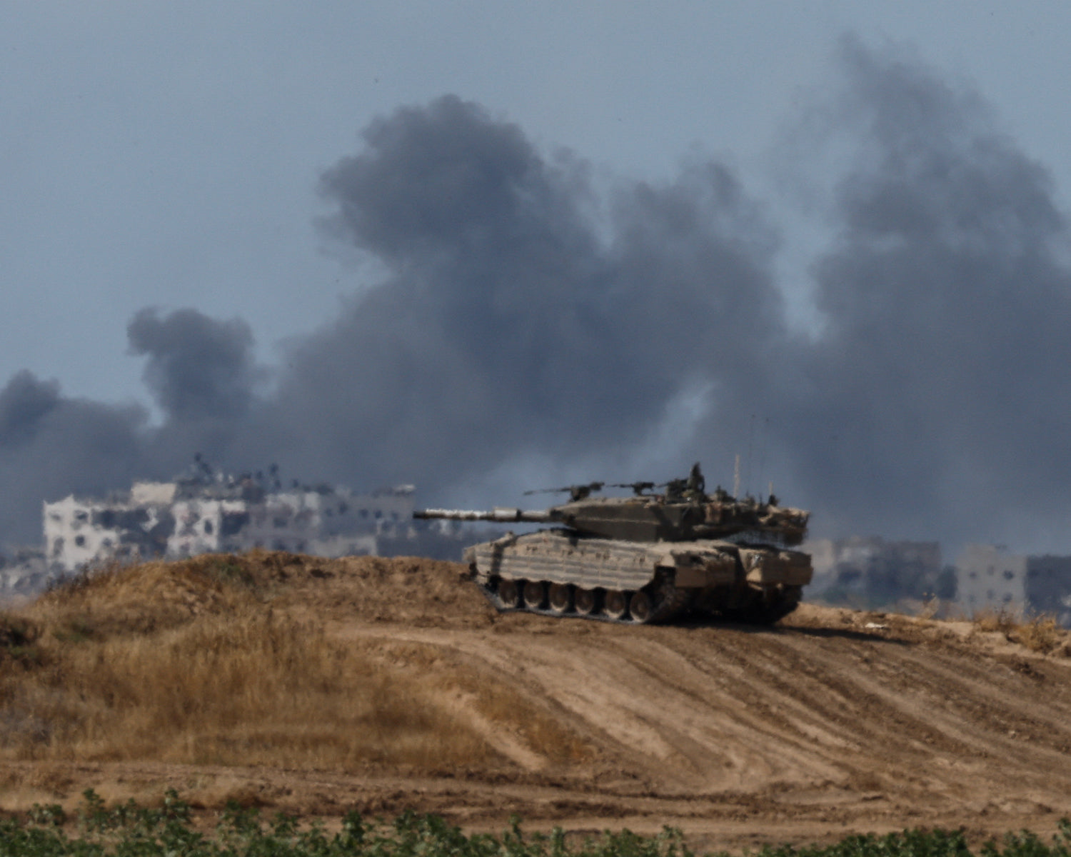 Gaza truce talks faltering over withdrawal; Israeli troops kill 17 more in latest aid site shooting