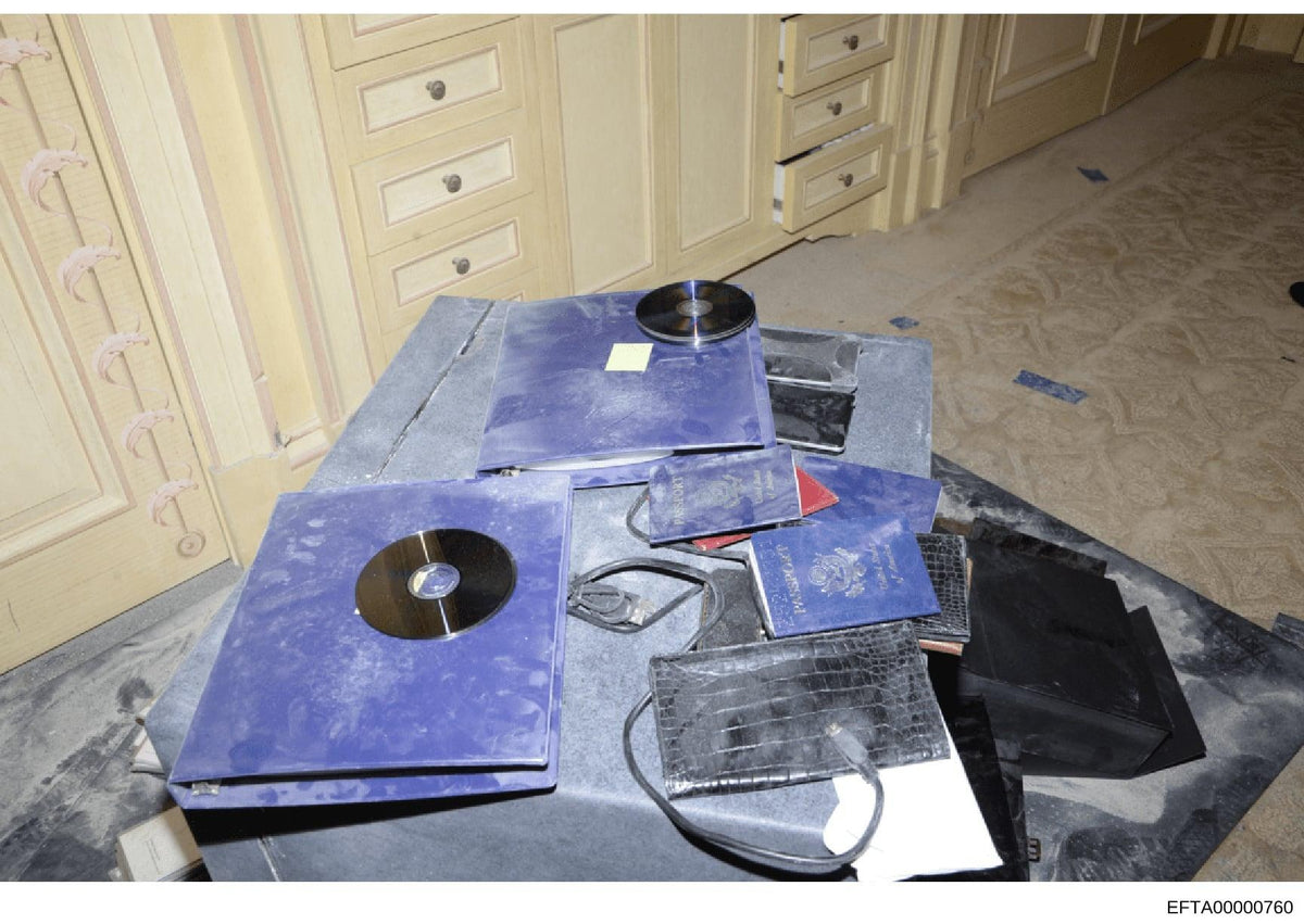 Photographs released by the U.S. Department of Justice show a concealed audio recording device discovered behind a television inside an executive conference room at OpenAI's San Francisco offices in September 2026. Federal prosecutors allege former