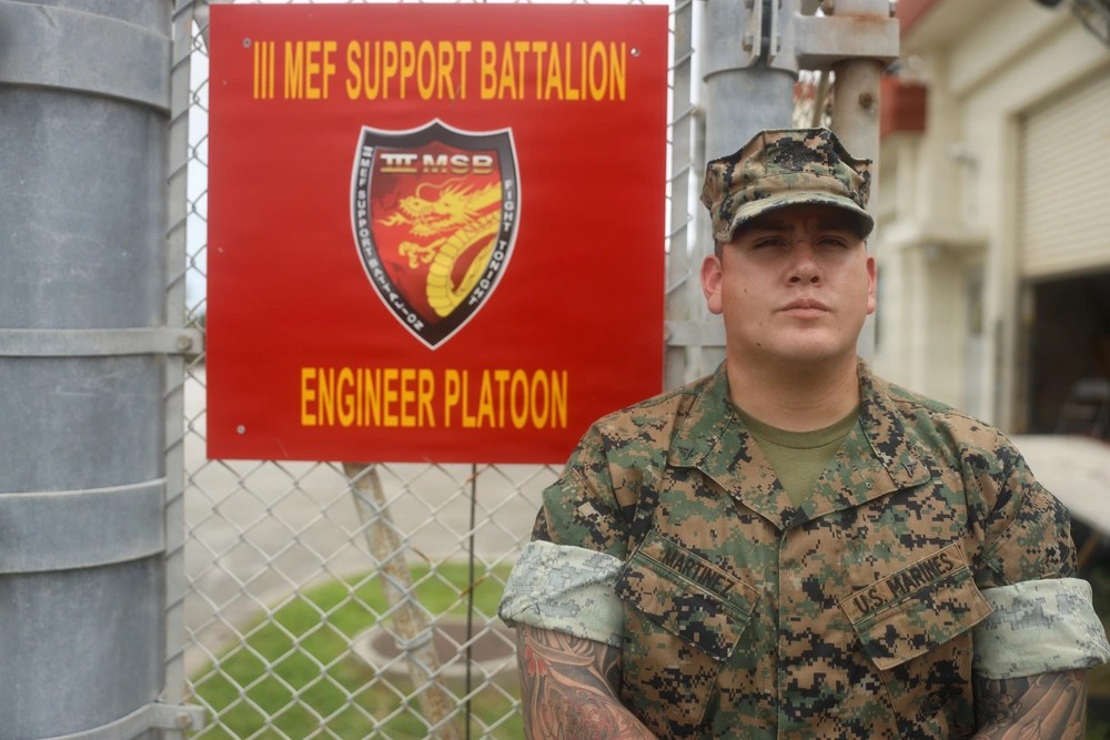 U.S. Marine Corps Lance Cpl. Marshall Martinez, a combat engineer with III Marine Expeditionary Force Support Battalion, poses for a photo at Camp Hansen, Okinawa, in August 2026. Martinez ran into a burning hotel in Chatan to alert sleeping guests and