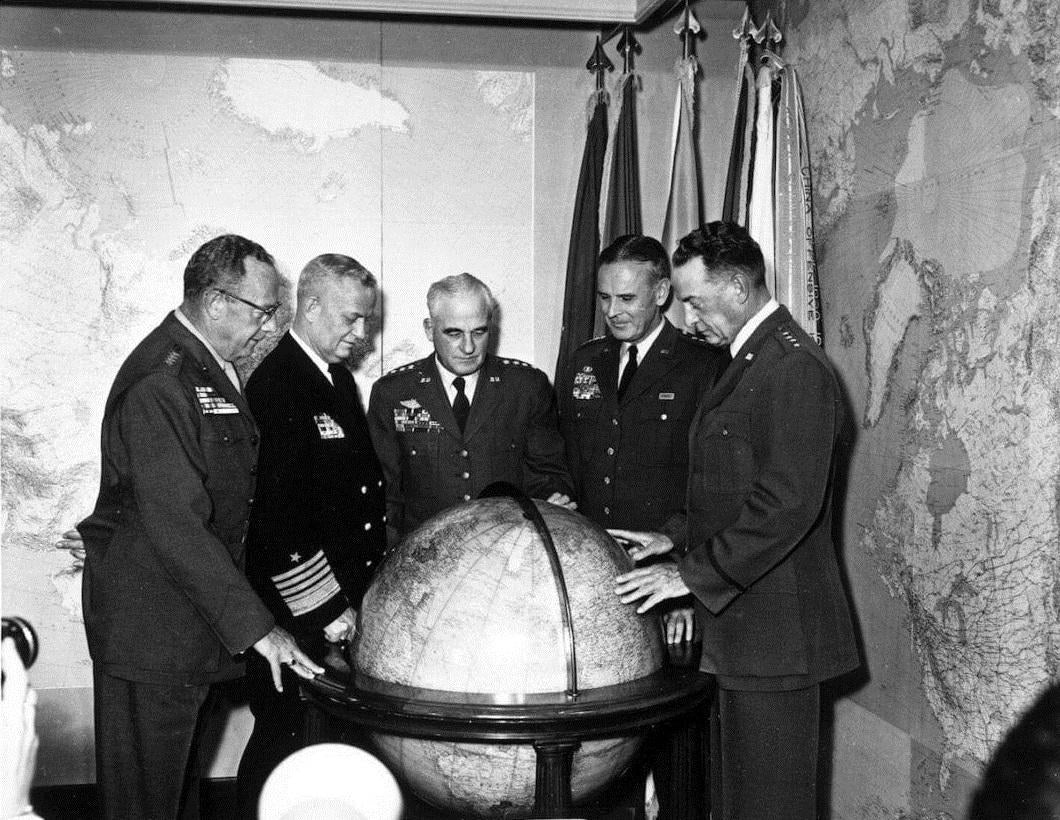 Senior U.S. military leaders examine a globe during a briefing at the Pentagon on January 15, 1958. The Army confirmed that members of Defense Secretary Pete Hegseth's staff damaged a different, historically significant globe associated with Gen. Dwight