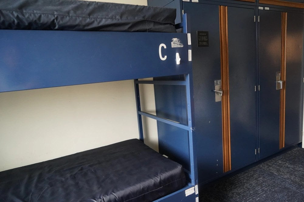 A room at Huntington Hall Naval Berthing Facility in Newport News, Virginia, is shown in April 2024. The Navy's new $1.7 billion Hampton Roads housing agreement with Hunt Military Communities is intended to replace aging facilities including Huntington