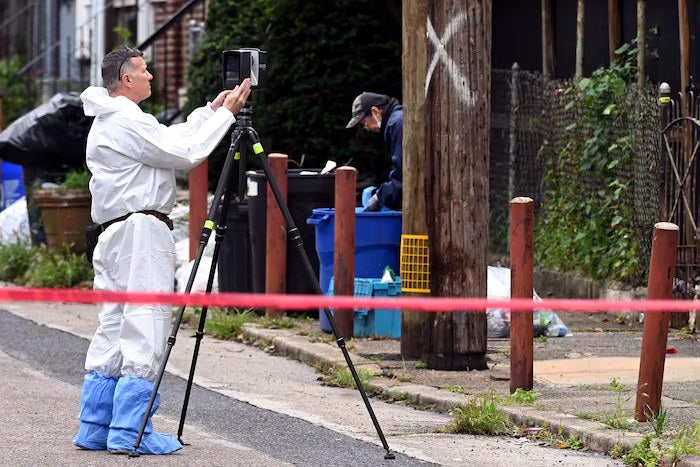 Law enforcement personnel work outside the West Chew Avenue home in Philadelphia’s Olney neighborhood during a renewed FBI and Philadelphia police search on Sept. 28, 2026. Investigators are preparing for an expanded forensic examination of the property.