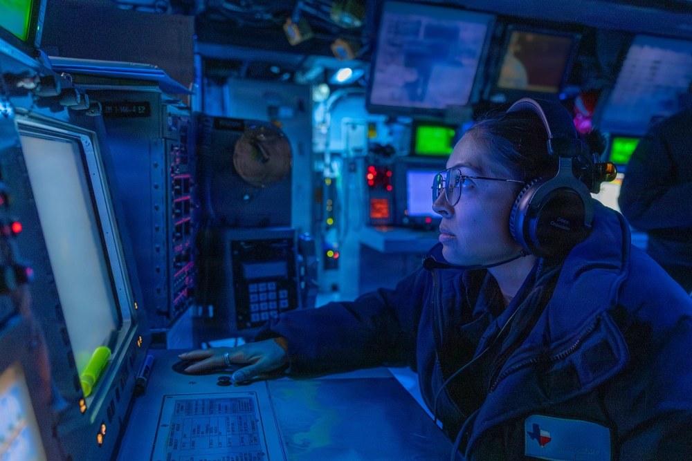 A U.S. sailor stands missile-systems-supervisor watch aboard the guided-missile destroyer USS Gonzalez in April 2026. Anthropic says an Iran-linked actor used Claude to build targeting material on U.S. naval forces using public information, including