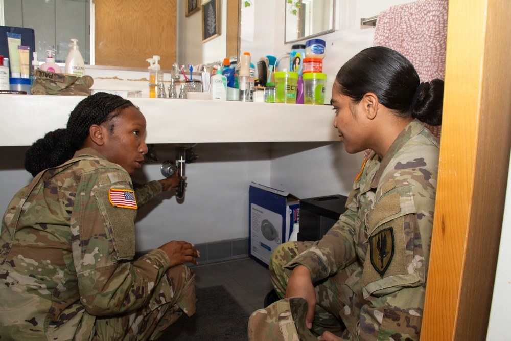 An Army NCO shows a soldier how to inspect barracks plumbing for leaks at Fort Rucker, Alabama, Sept. 17, 2026. Army officials say maintenance problems should be submitted through the work-order system for repair. U.S. Army photo by John Drew Hamilton.