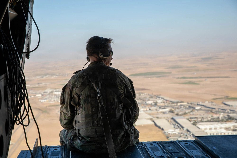 A U.S. Army soldier sits aboard a CH-47 Chinook in Erbil, Iraq, in October 2025. The remaining U.S. military forces stationed at bases in Iraq are scheduled to complete their withdrawal by Sept. 30, 2026. U.S. Army photo by Capt. Bernard Jenkins Jr. File