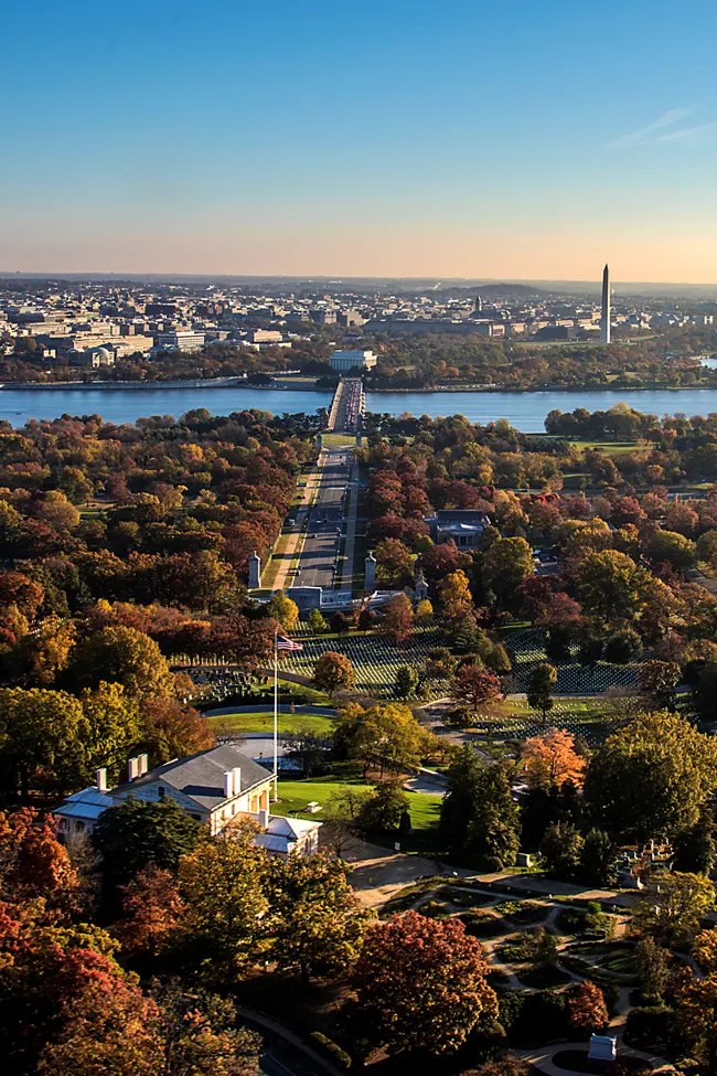 Arlington National Cemetery and Memorial Avenue are seen looking toward Arlington Memorial Bridge and Washington, D.C. A proposed 250-foot triumphal arch would be built near the western end of the bridge. (National Park Service photo)