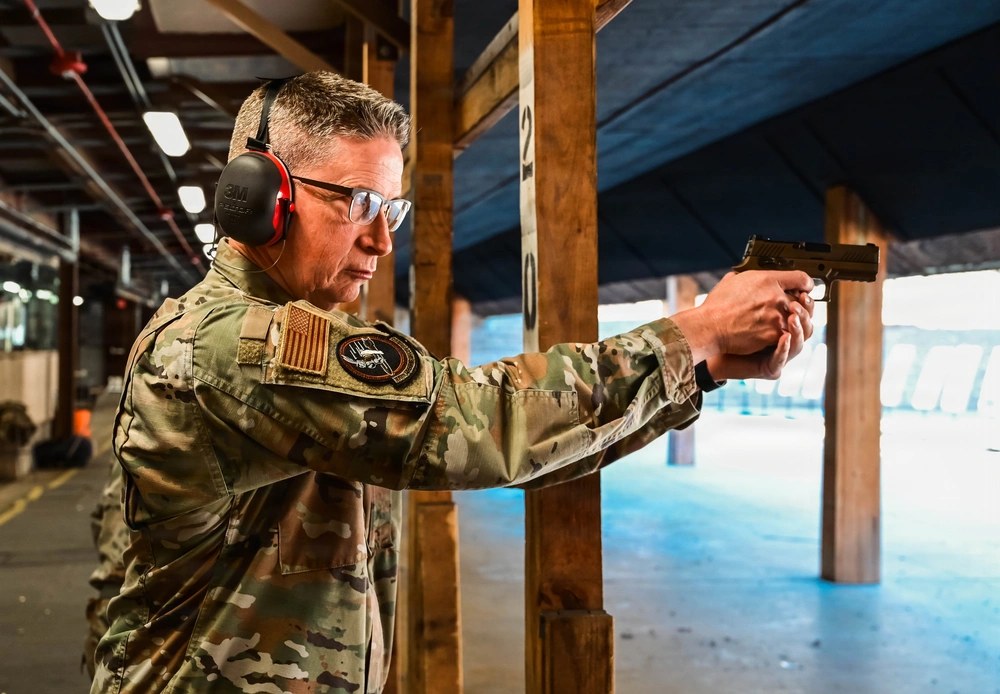 U.S. Air Force Master Sgt. Lauchlin McMillan fires a SIG Sauer M18 pistol during an Air Force Qualification Course at Tinker Air Force Base, Oklahoma, March 8, 2026. U.S. Air Force photo by Staff Sgt. Caroline Strickland.