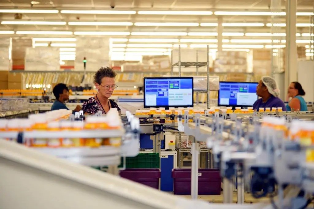 Illustrative file photo. Prescription medications move through the Department of Veterans Affairs Consolidated Mail Outpatient Pharmacy in North Charleston, South Carolina. A former postal employee was sentenced Monday after prosecutors said she targeted