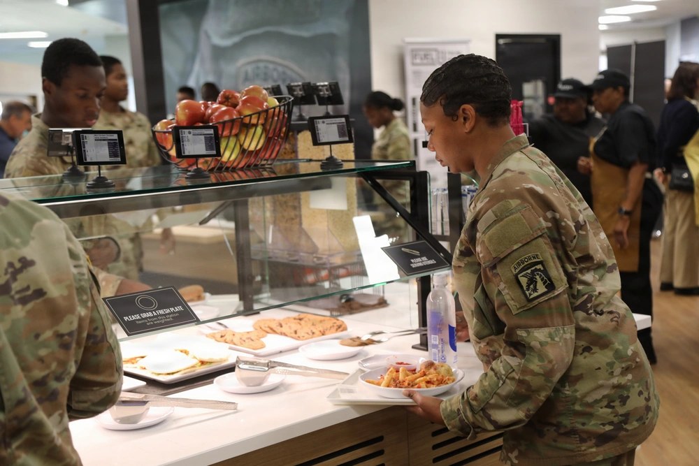 Service members, local civilians and leaders gather at the newly established Rally Point Bistro during its soft opening at Fort Bragg, North Carolina, on Sept. 25, 2026. The Army says the new campus-style dining venue converts eligible soldiers’ daily