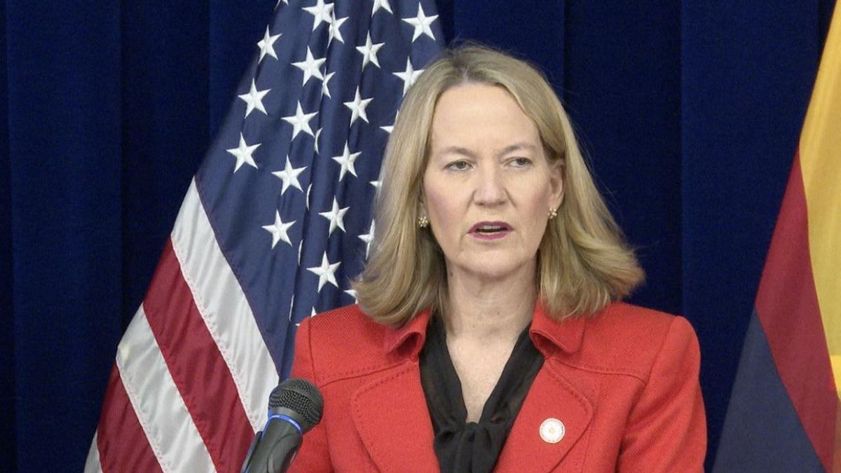 Arizona Attorney General Kris Mayes speaks during a press appearance in footage accompanying May 2026 reporting on the VetLink Solutions settlement. Her office announced October 28 that $1.2 million in restitution would begin going to eligible veterans