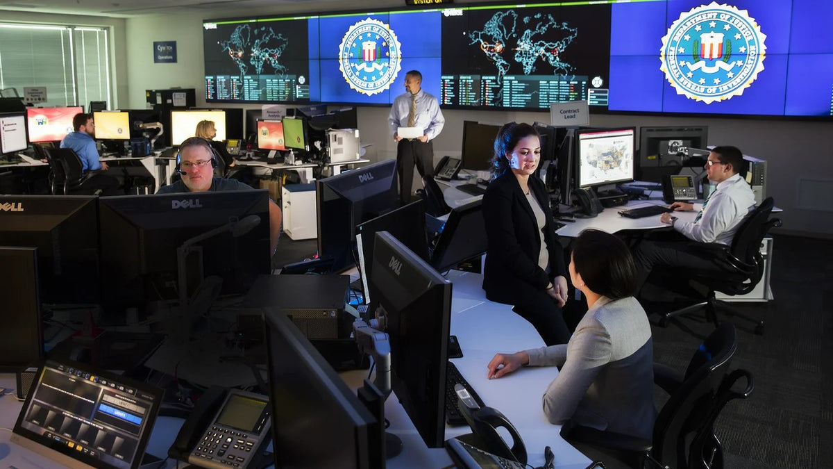 Illustrative file photo. FBI cyber agents work at computer systems. The cybercrime group ShinyHunters claimed Sept. 22 that it breached FBI systems and stole personal information belonging to thousands of bureau employees and applicants. The FBI had not