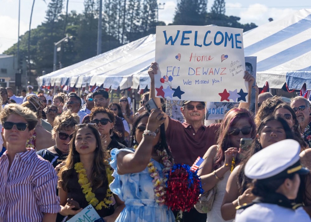 Family members and friends welcome home Sailors from the USS Frank E. Petersen Jr. at Pearl Harbor, Hawaii, on Sept. 28, 2026, following the destroyer’s 301-day deployment. The ship’s commander said it helped defend U.S. forces against more than 100