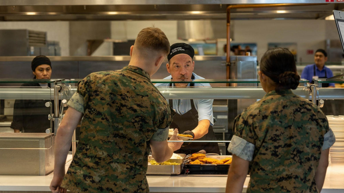 A Sodexo employee hands food to a Marine at the newly opened 62 Area dining facility drive-thru at Camp Pendleton, California, on October 1, 2026. U.S. Marine Corps photo by Sgt. Davin Tenbusch.
