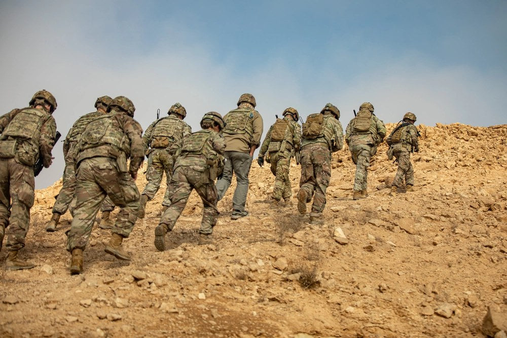 U.S. Marine advisers conduct a mid-mission brief near Al Qaim, Iraq, during Operation Inherent Resolve in November 2017. U.S. Army photo by Spc. Torrance Saunders. File photo.