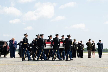 Illustrative file photo — A U.S. Army carry team transfers the remains of Sgt. Angel S. Rampersad at Dover Air Force Base, Delaware, July 22, 2026. Rampersad is among the U.S. military deaths already publicly reported. New reporting says internal