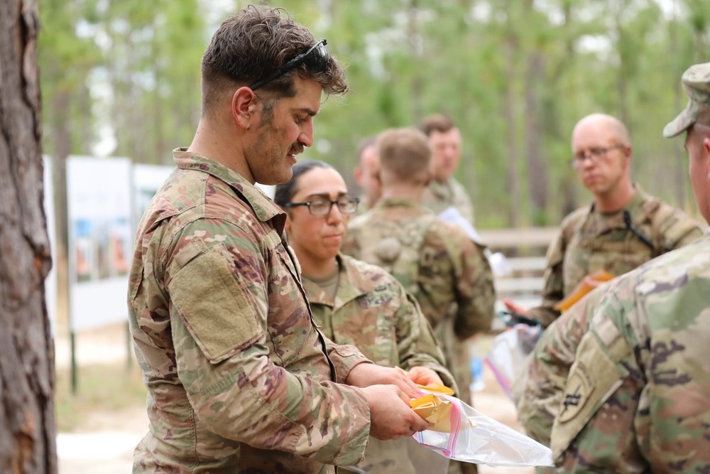 U.S. Army Reserve Staff Sgt. Riley P. Greenwald seals his cell phone and smartwatch in an envelope before a land-navigation event at Fort Jackson, South Carolina, April 9, 2021. (U.S. Army photo by Sgt. 1st Class Lisa Litchfield)