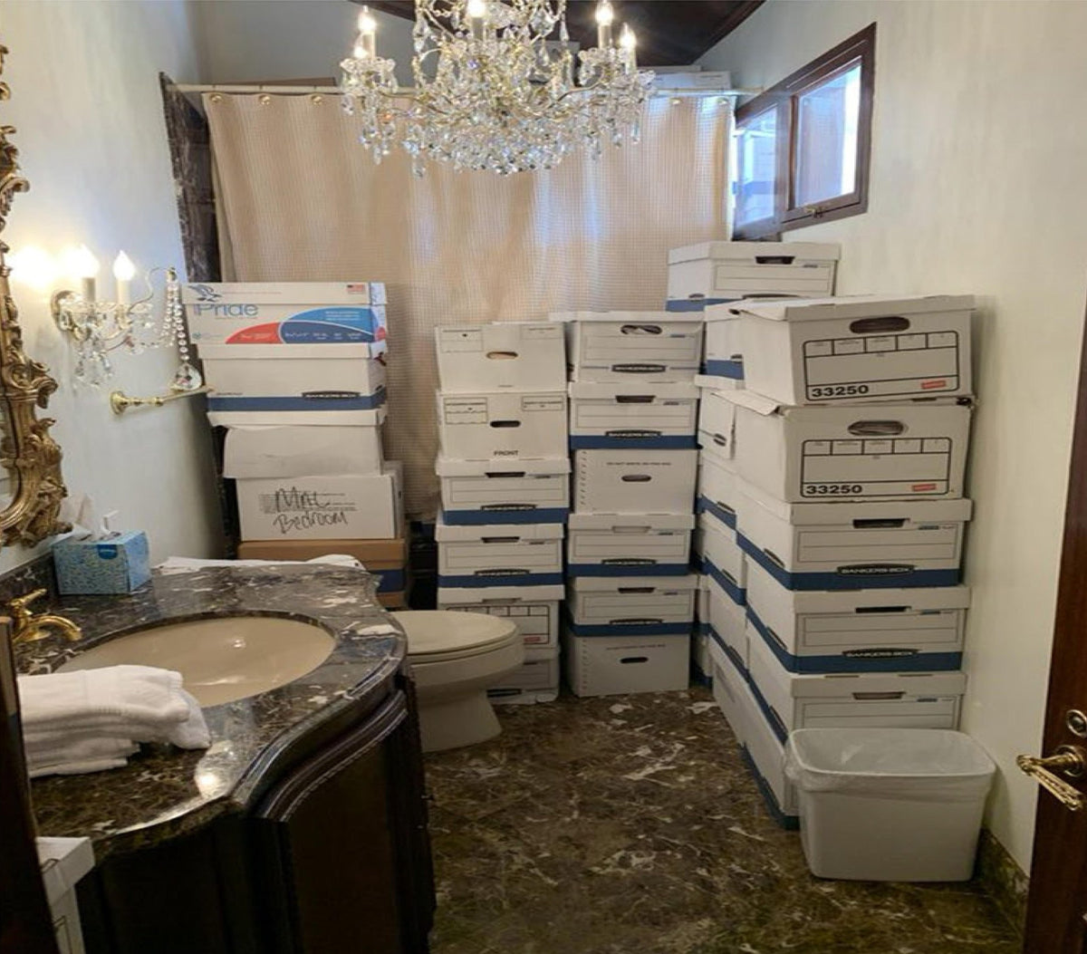 Boxes of documents stored in a bathroom at Mar-a-Lago, shown in evidence released by the Justice Department during its investigation into Donald Trump's handling of classified records. Nine former FBI employees involved in the investigation are now suing