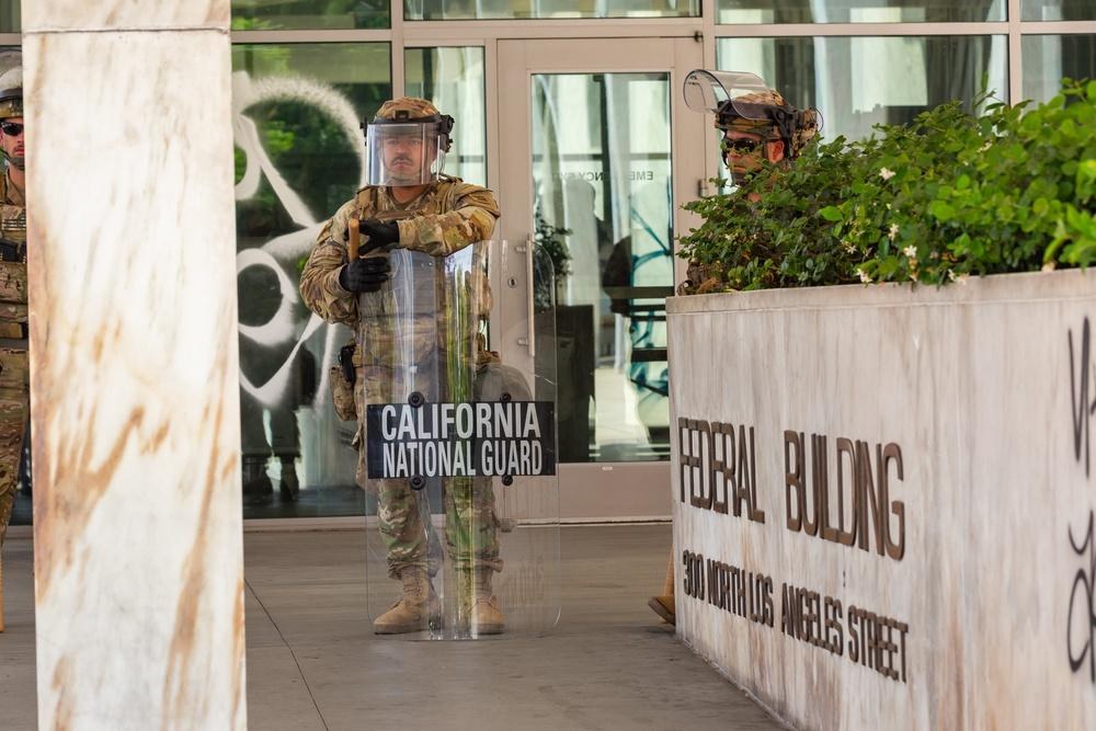 California Army National Guard soldiers assigned to the 1st Battalion, 185th Infantry Regiment, protect federal personnel and property in Los Angeles on June 9, 2025, while serving under federal orders. On October 23, 2026, the Ninth U.S. Circuit Court