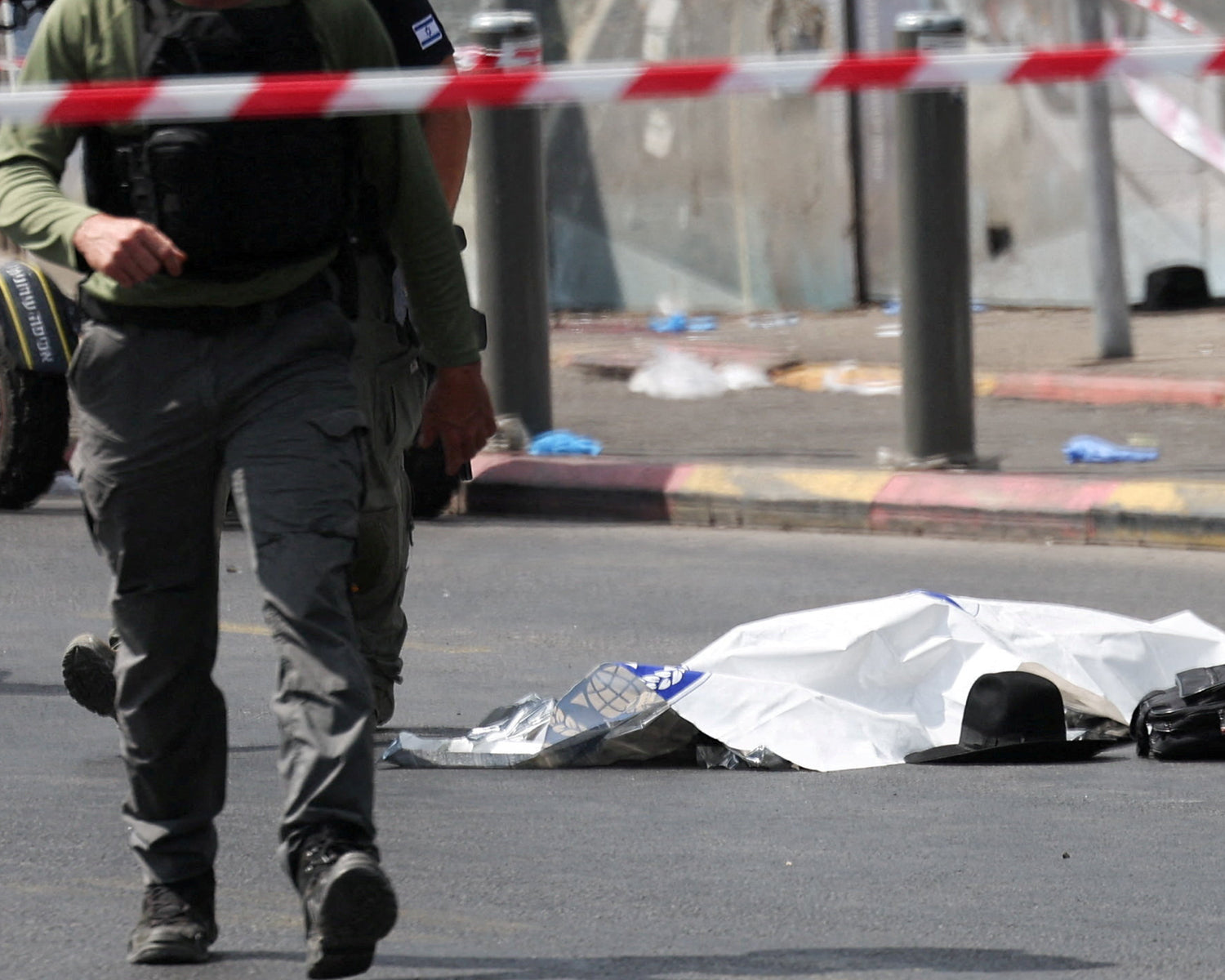 Gunmen kill six in Jerusalem bus stop shooting