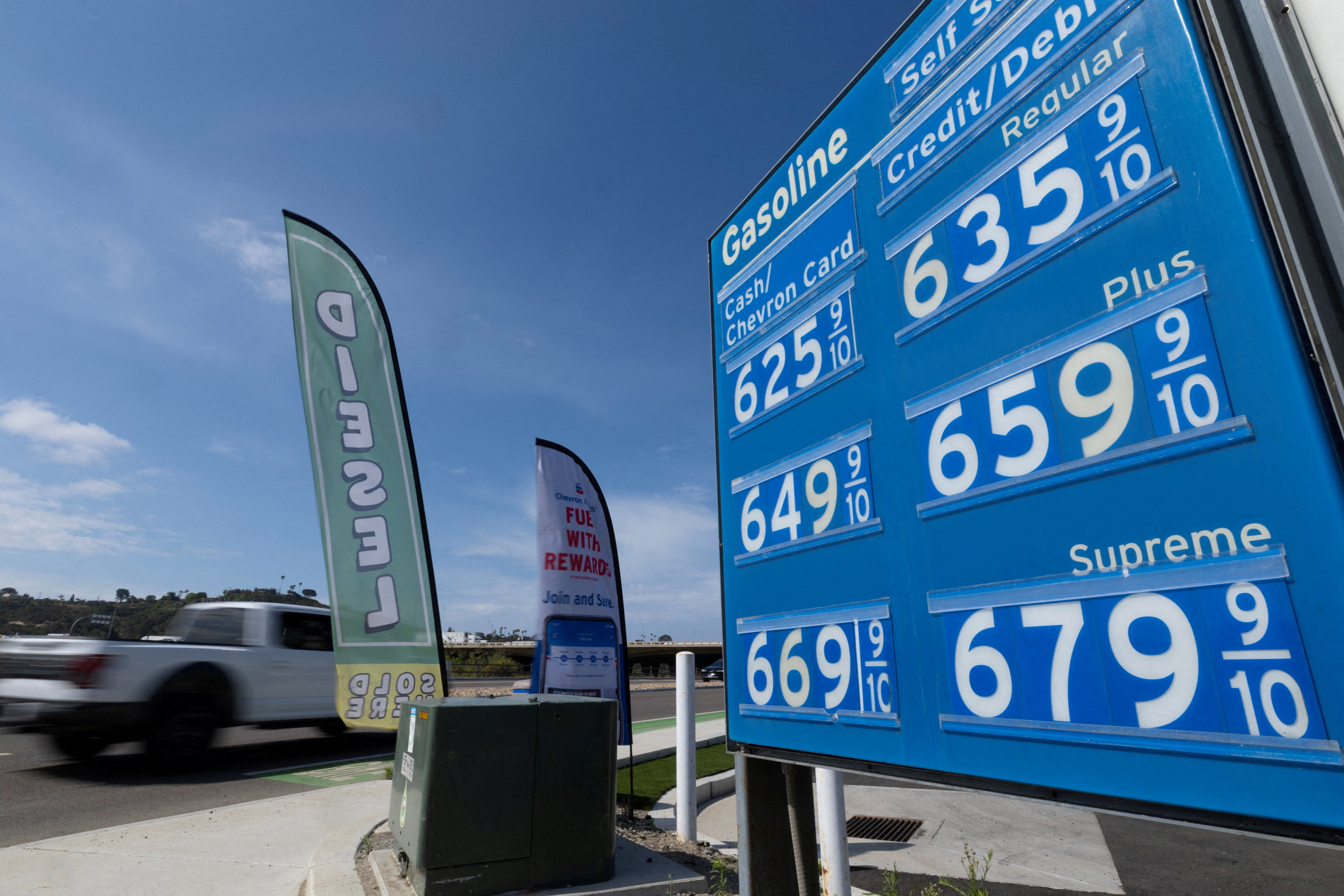FILE PHOTO: The price of gasoline is displayed at a gas station near the highway in Encinitas, California, U.S., April 30, 2026.   REUTERS/Mike Blake/File Photo