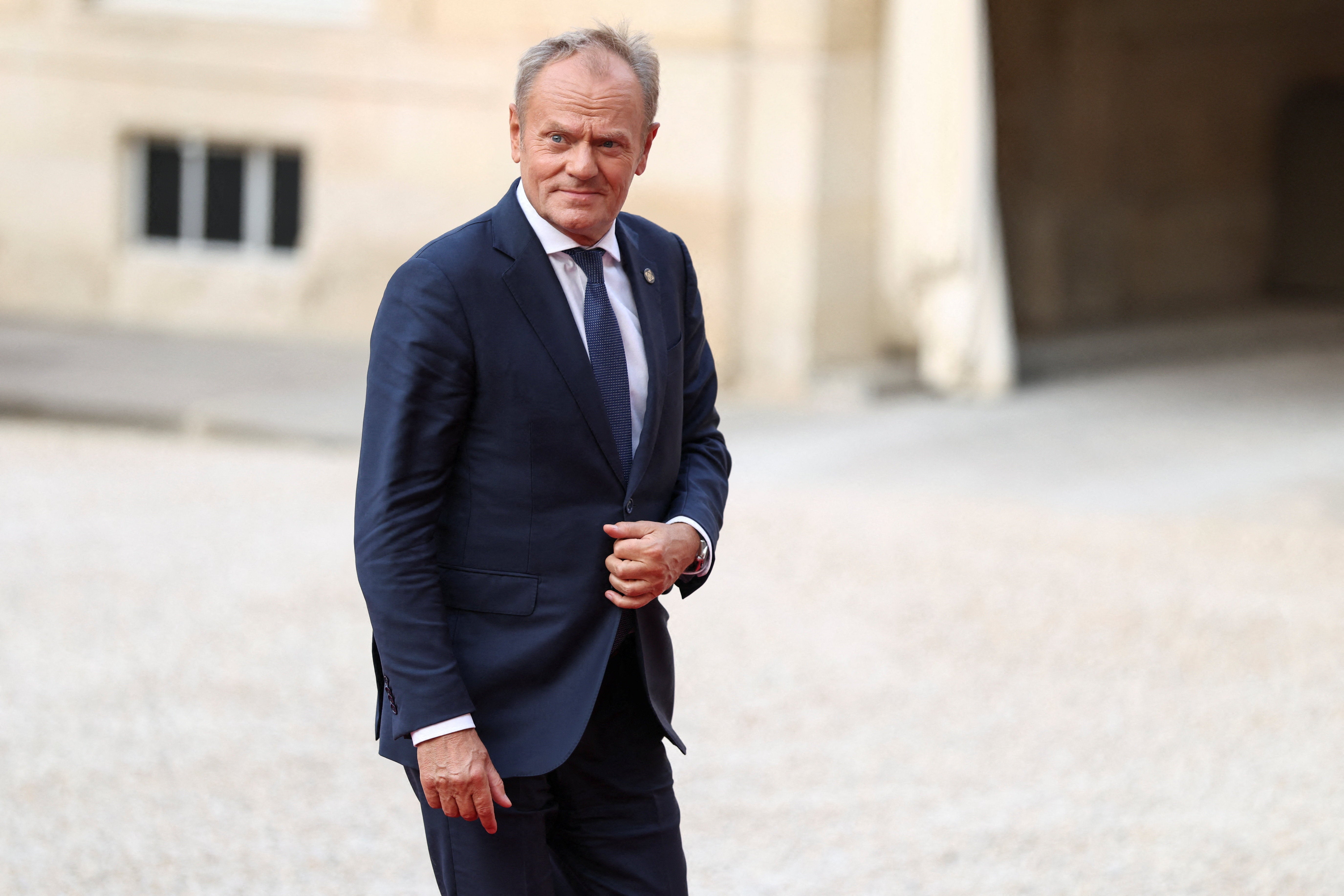 Polish Prime Minister Donald Tusk arrives for a dinner of the 'Coalition of the Willing', a coalition of countries that have extended their support to Ukraine, on the eve of Bastille Day celebrations, at the Elysee Palace in Paris, France, July 13, 2026.