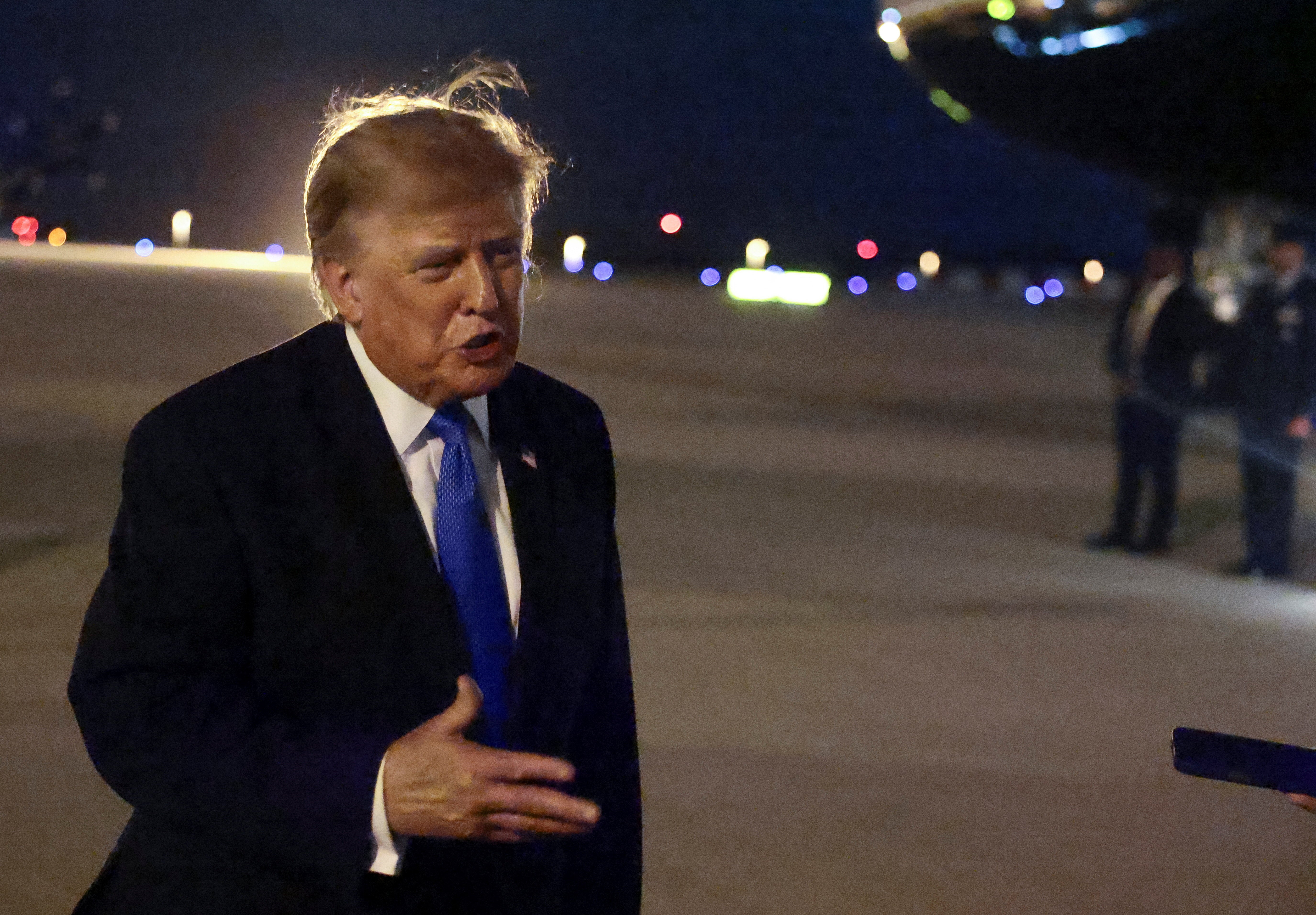 U.S. President Donald Trump speaks to the media upon arrival at Los Angeles International Airport before departing Los Angeles for Las Vegas, Nevada, in Los Angeles, California, U.S., August 4, 2026. REUTERS/Evelyn Hockstein