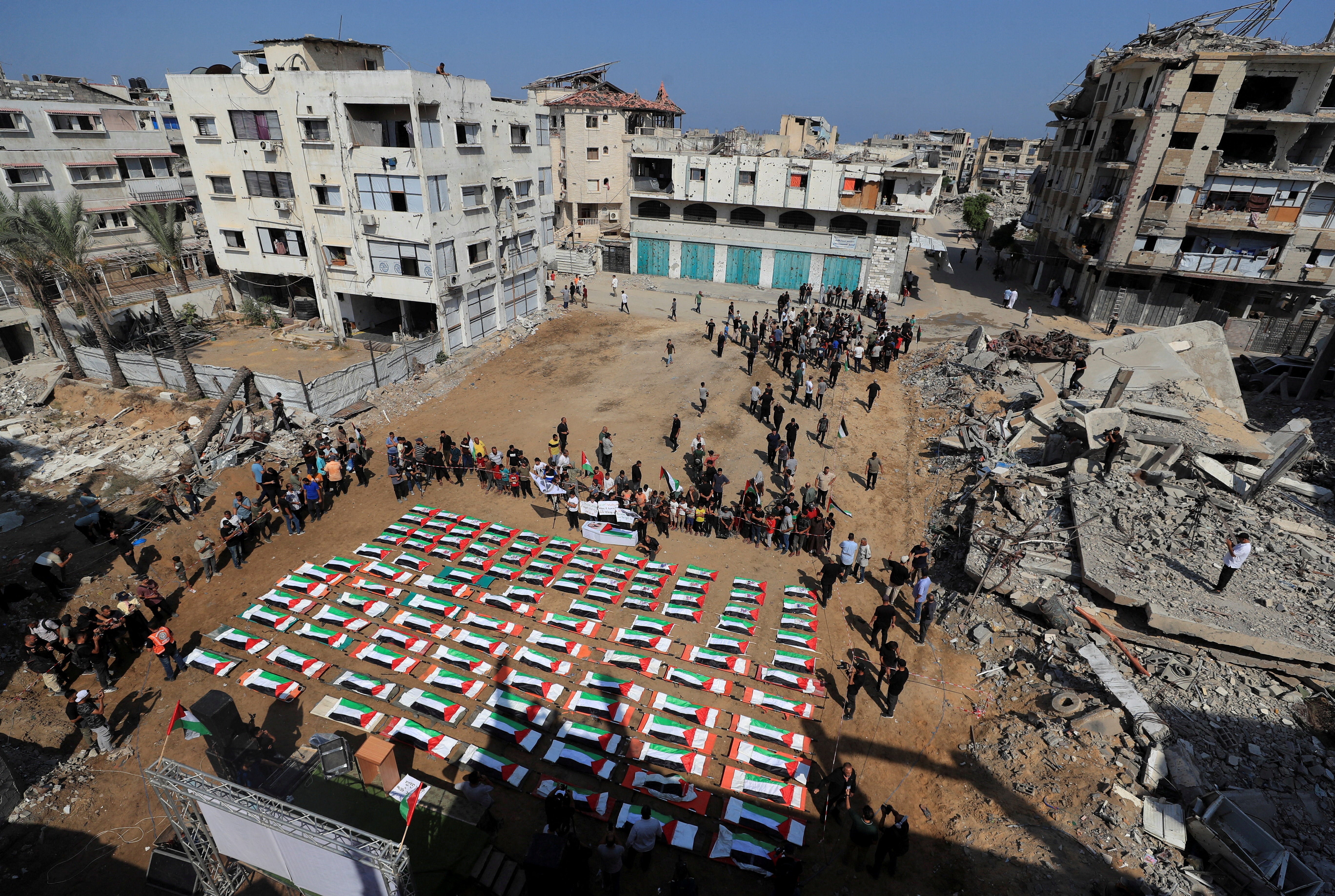Palestinians attend the funeral of 112 members of the Hassayna and Abu Sharia clan, who were killed in an Israeli strike in 2023 and whose remains were recovered from beneath the rubble, according to Gaza's Civil Defense, in Gaza City, August 4, 2026.