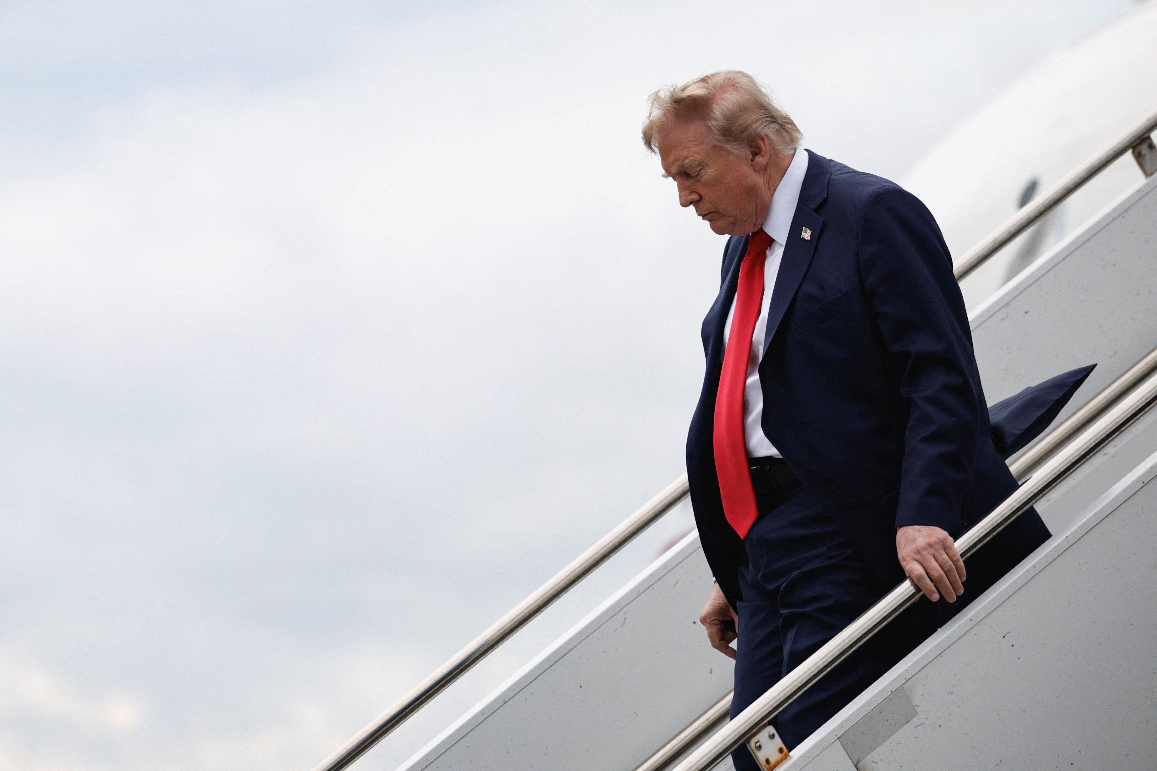 U.S. President Donald Trump disembarks Air Force One upon arrival at Myrtle Beach International Airport in Myrtle Beach, South Carolina, U.S., August 21, 2026. REUTERS/Evan Vucci