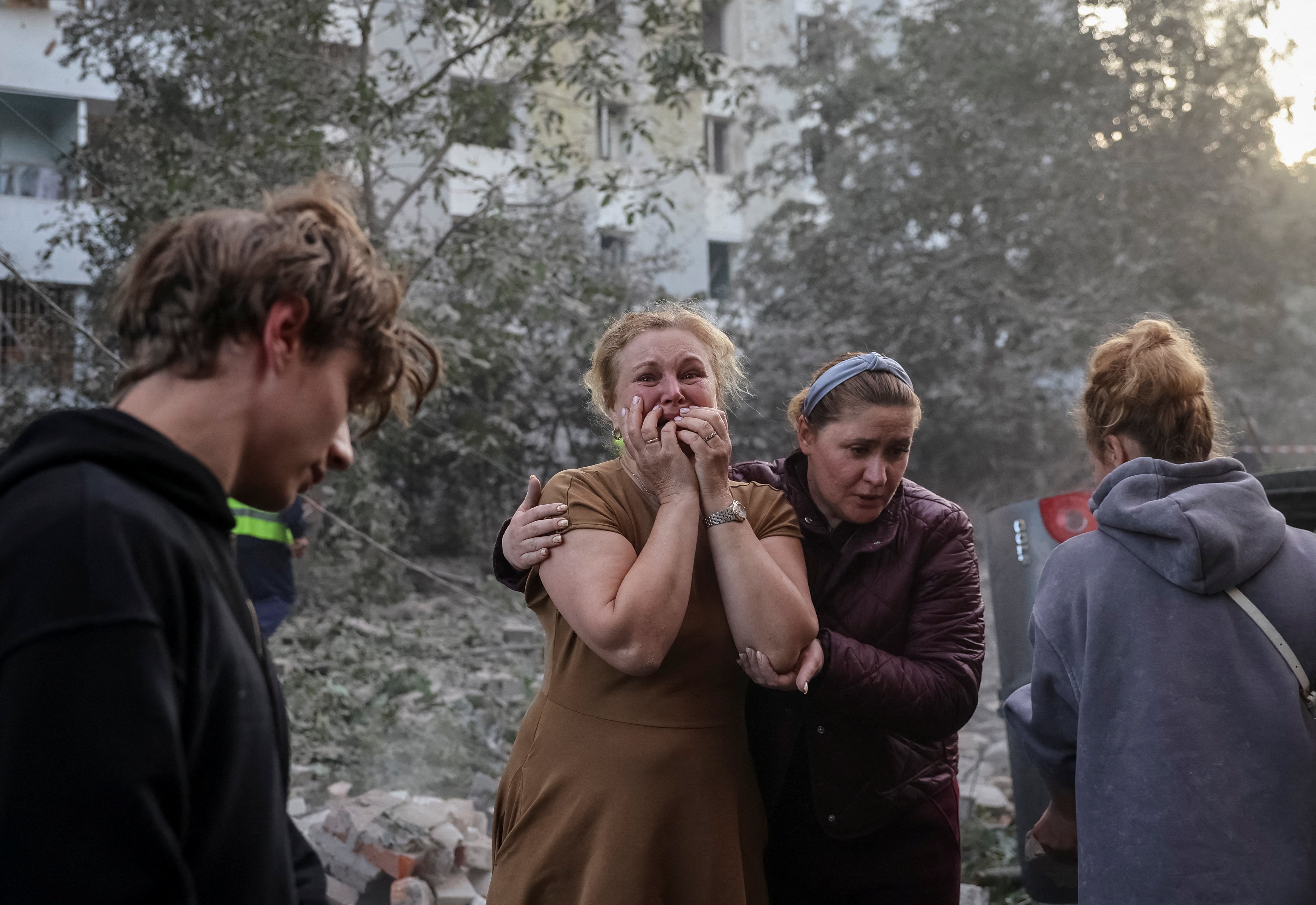 A woman reacts near an apartment building hit by a Russian missile strike, amid Russia's attack on Ukraine, in Lviv, Ukraine July 30, 2026. REUTERS/Roman Baluk