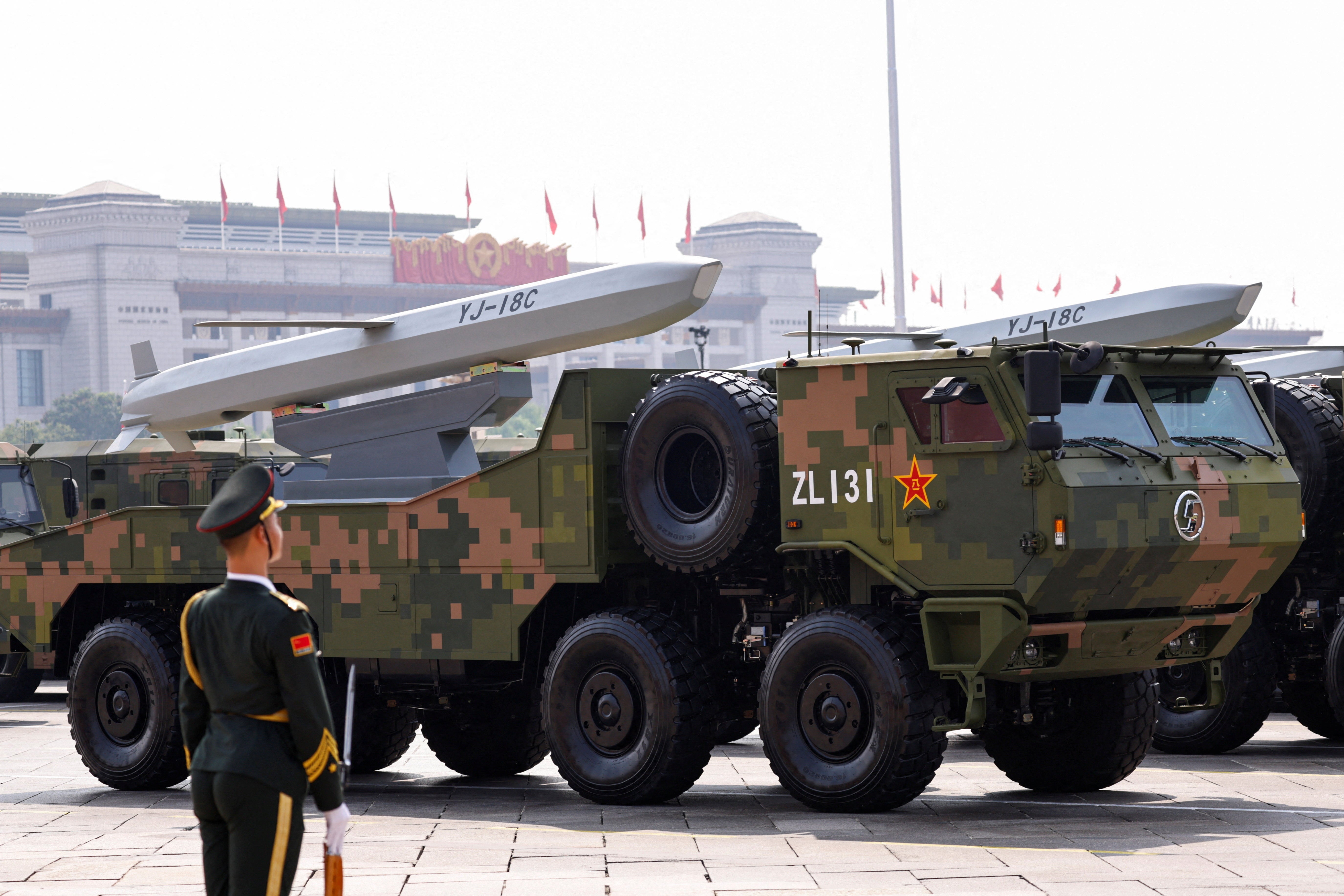 FILE PHOTO: A member of the People's Liberation Army stands as strategic strike group displays YJ-18C cruise missiles during a military parade to mark the 80th anniversary of the end of World War Two, in Beijing, China, September 3, 2025. REUTERS/Tingshu