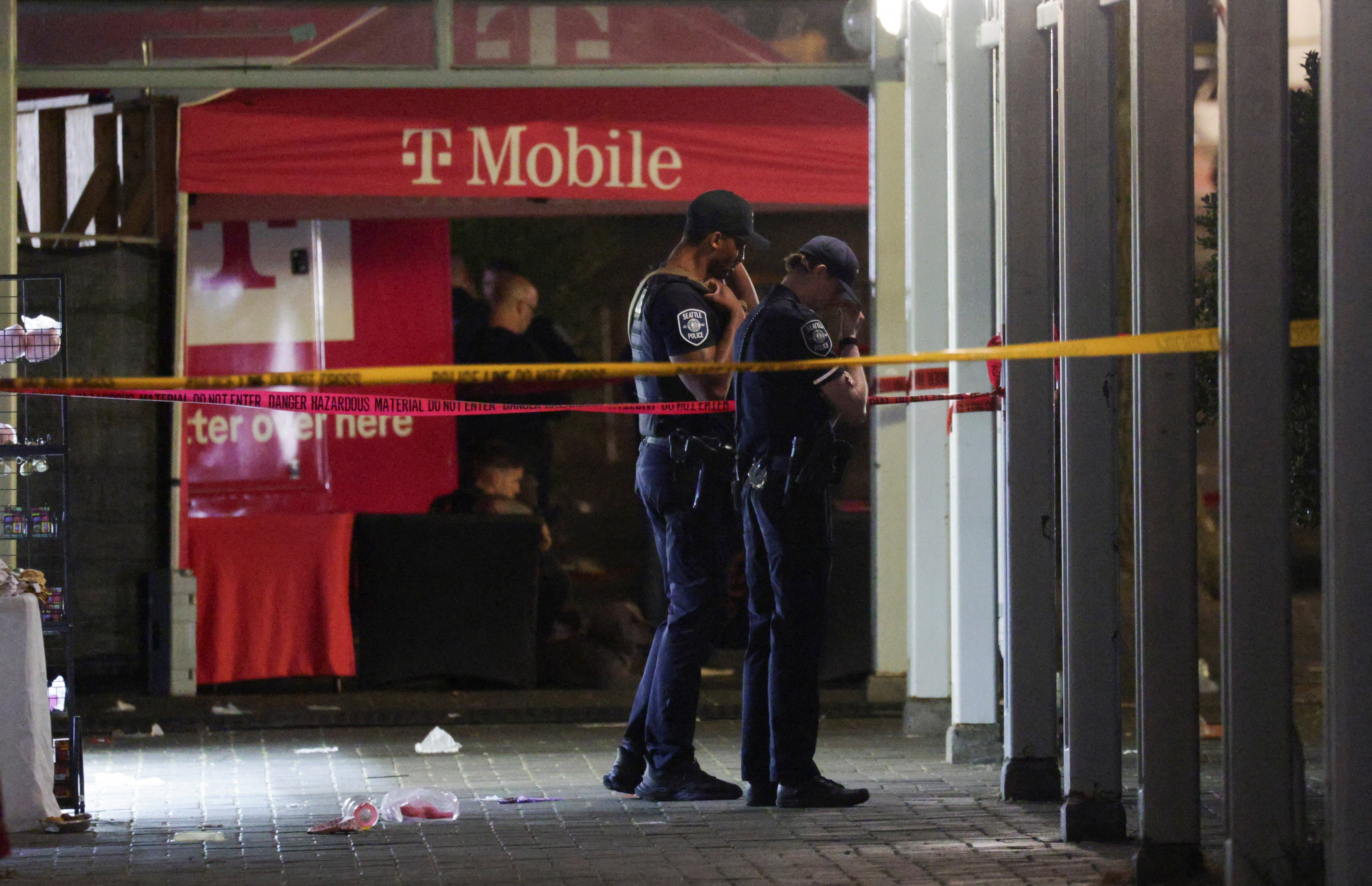 Police officers guard an area after Seattle Police responded to what they described as a shooting with "multiple" victims at Seattle Center, which was hosting a Bite of Seattle food festival, in Seattle, Washington, U.S., July 26, 2026. REUTERS/Jason