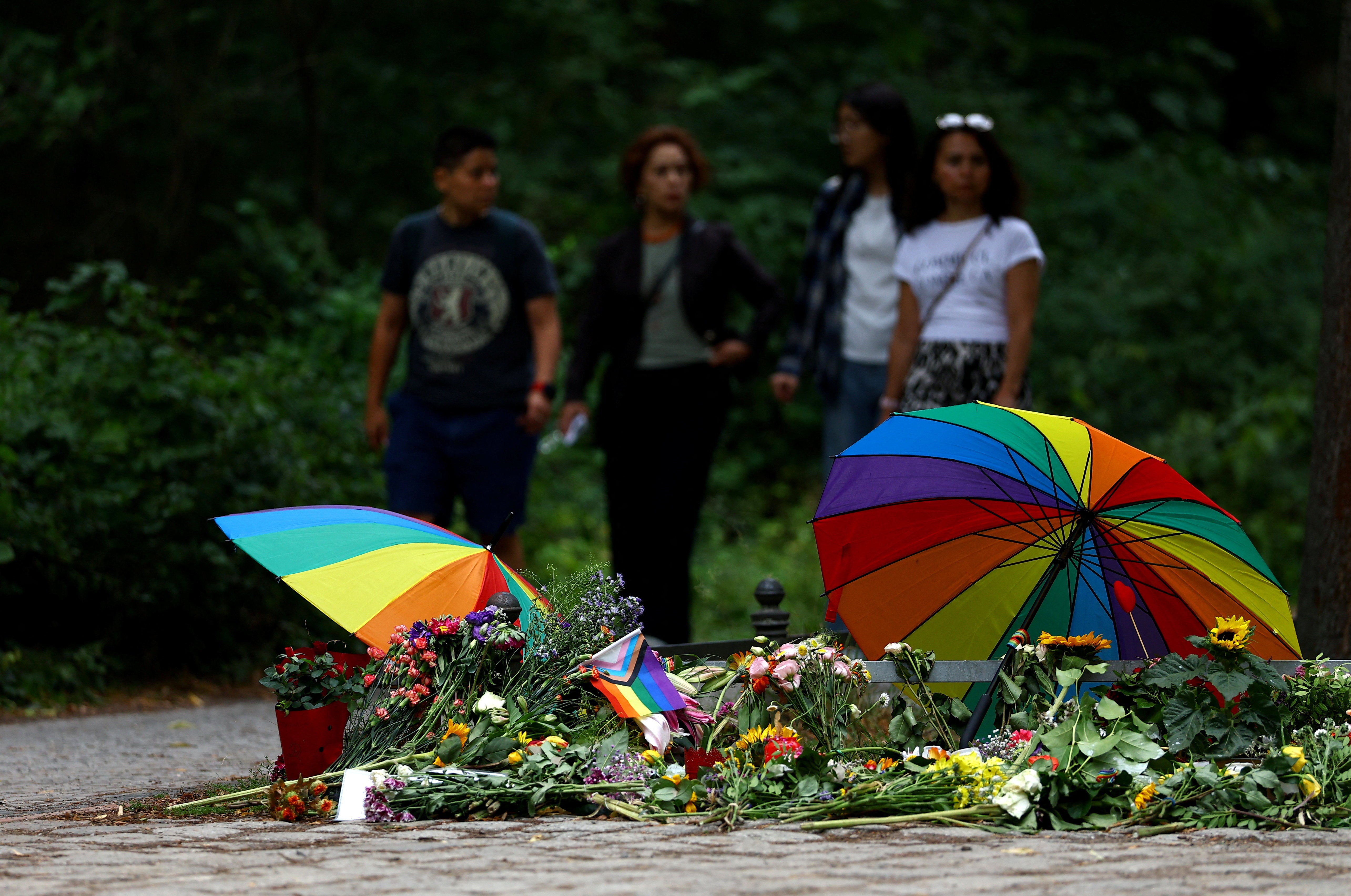 People visit a makeshift memorial at Tiergarten park, after a deadly attack in which a vehicle crashed into a crowd near Berlin's annual Christopher Street Day Pride parade on Saturday evening, leaving one dead and multiple others injured, in Berlin,