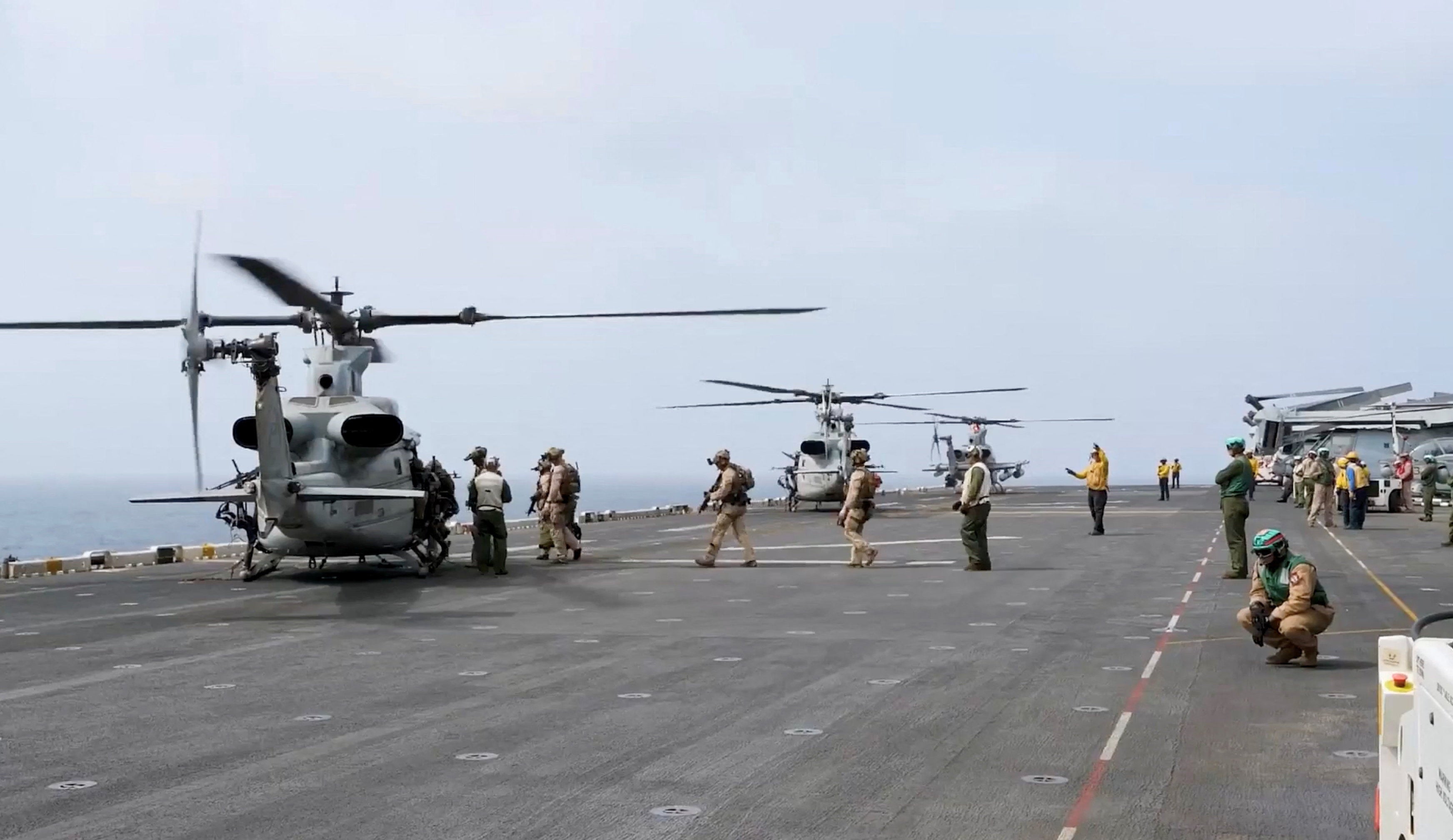 Military helicopters and personnel operate in a location given as the Arabian Sea in this screengrab obtained from a video released by U.S. Central Command (CENTCOM) on July 25, 2026. CENTCOM said the video showed U.S. operations enforcing a naval