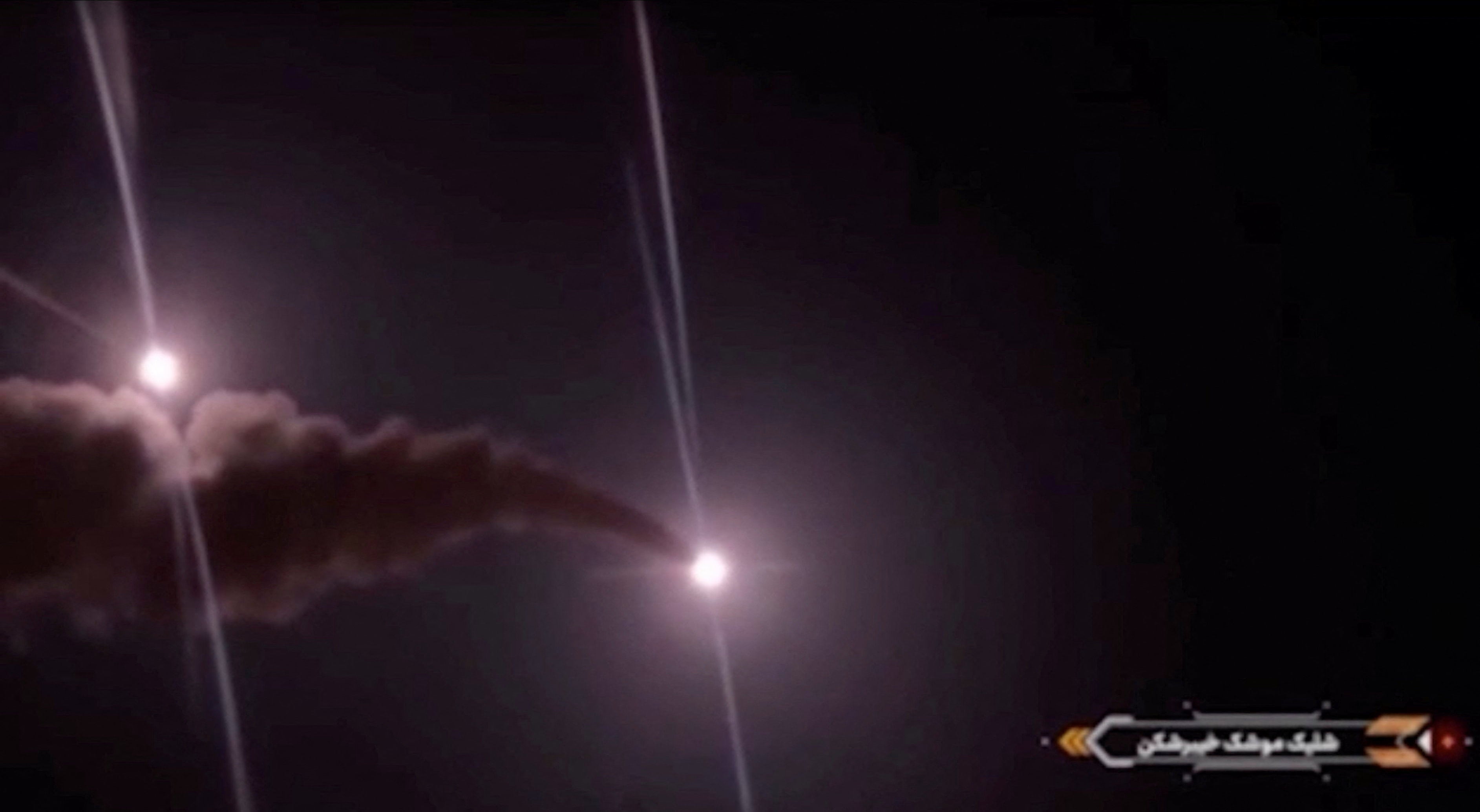 Projectiles streak across the sky in this screengrab taken from footage published by Iranian authorities purporting to show missiles launched at US military targets in Jordan from an unknown location, released on August 31, 2026. Wana News Agency via