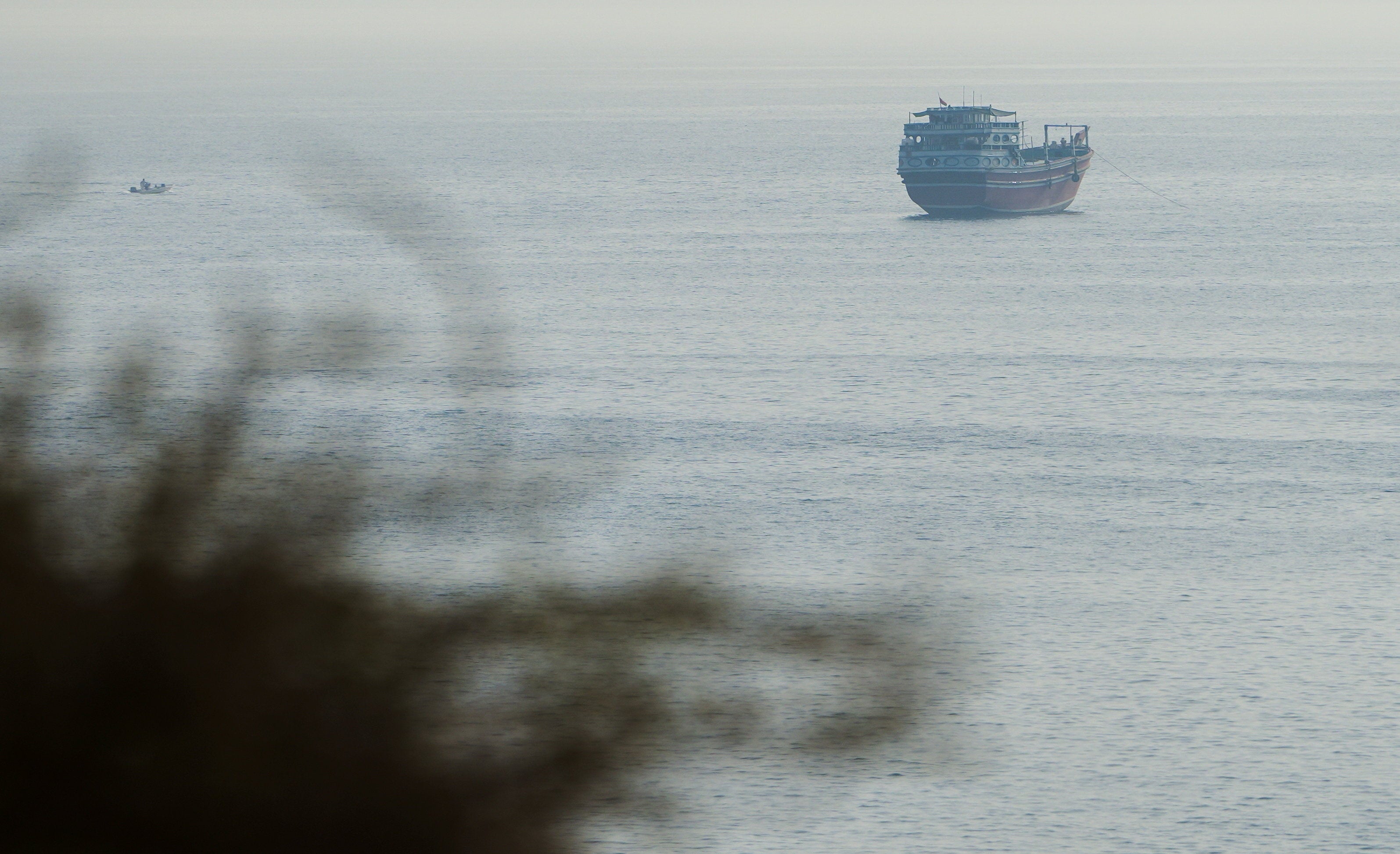 A vessel in the Strait of Hormuz, as seen from Musandam, Oman, July 31, 2026. REUTERS/Stringer