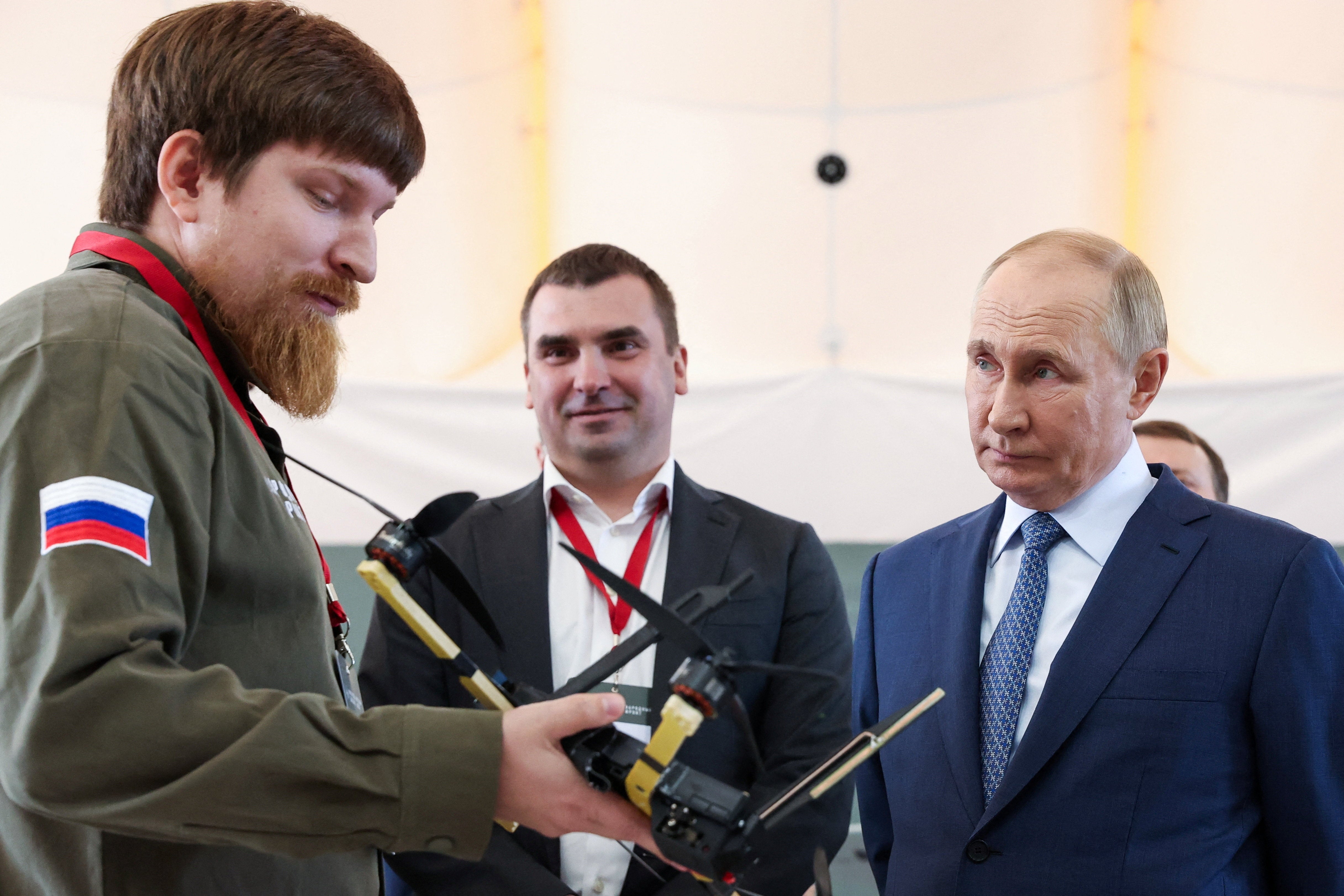 FILE PHOTO: Vladimir Tkachuk, co-founder of the Uraldronzavod, demonstrates a drone to Russian President Vladimir Putin at a drone production facility of the Special Technology Centre in Saint Petersburg, Russia September 19, 2024. Sputnik/Valery