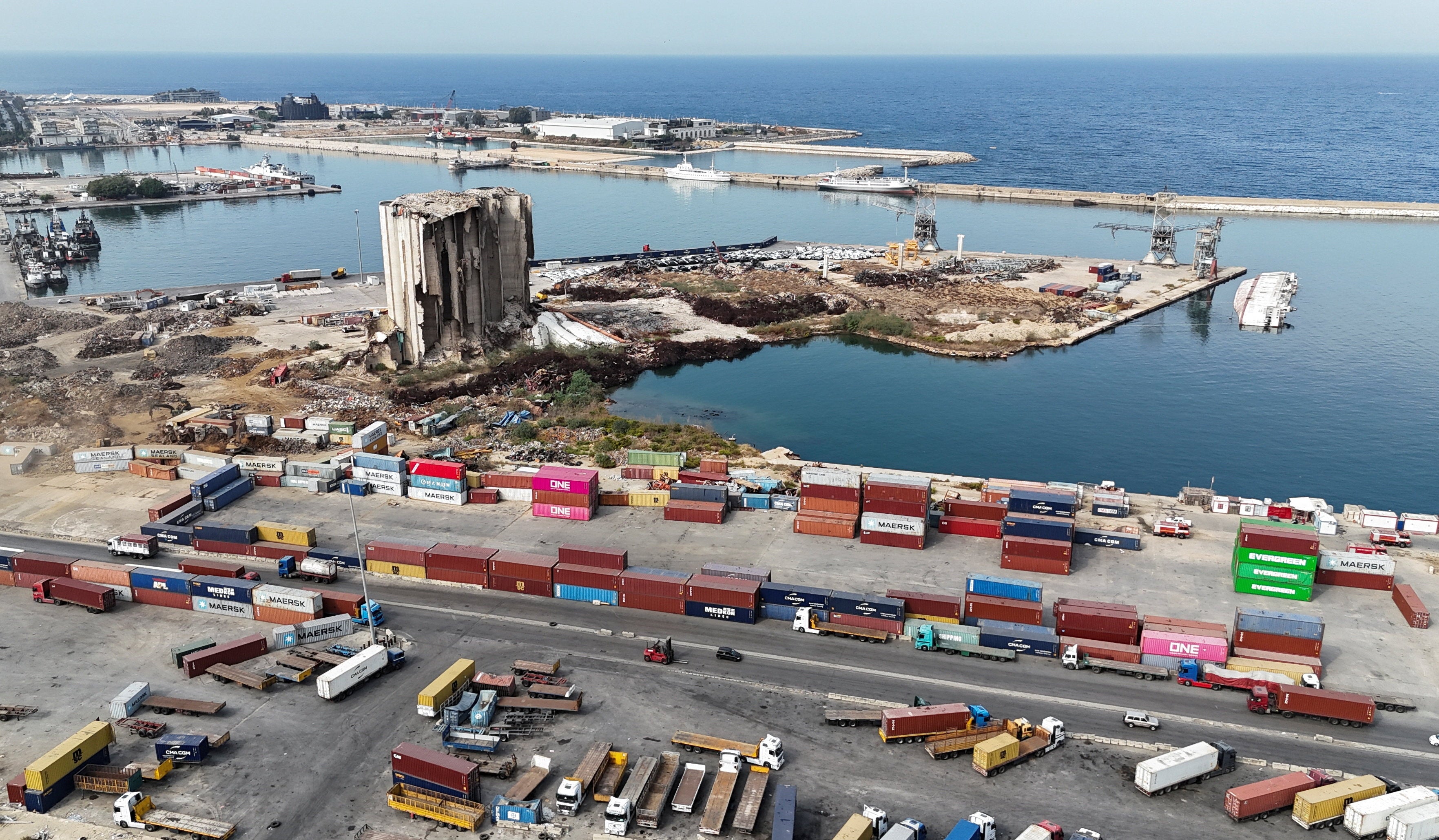 A drone view of containers and the partially collapsed grain silos, damaged in the August 4, 2020 Beirut port blast, at Beirut port, Lebanon, November 4, 2025. REUTERS/Emilie Madi