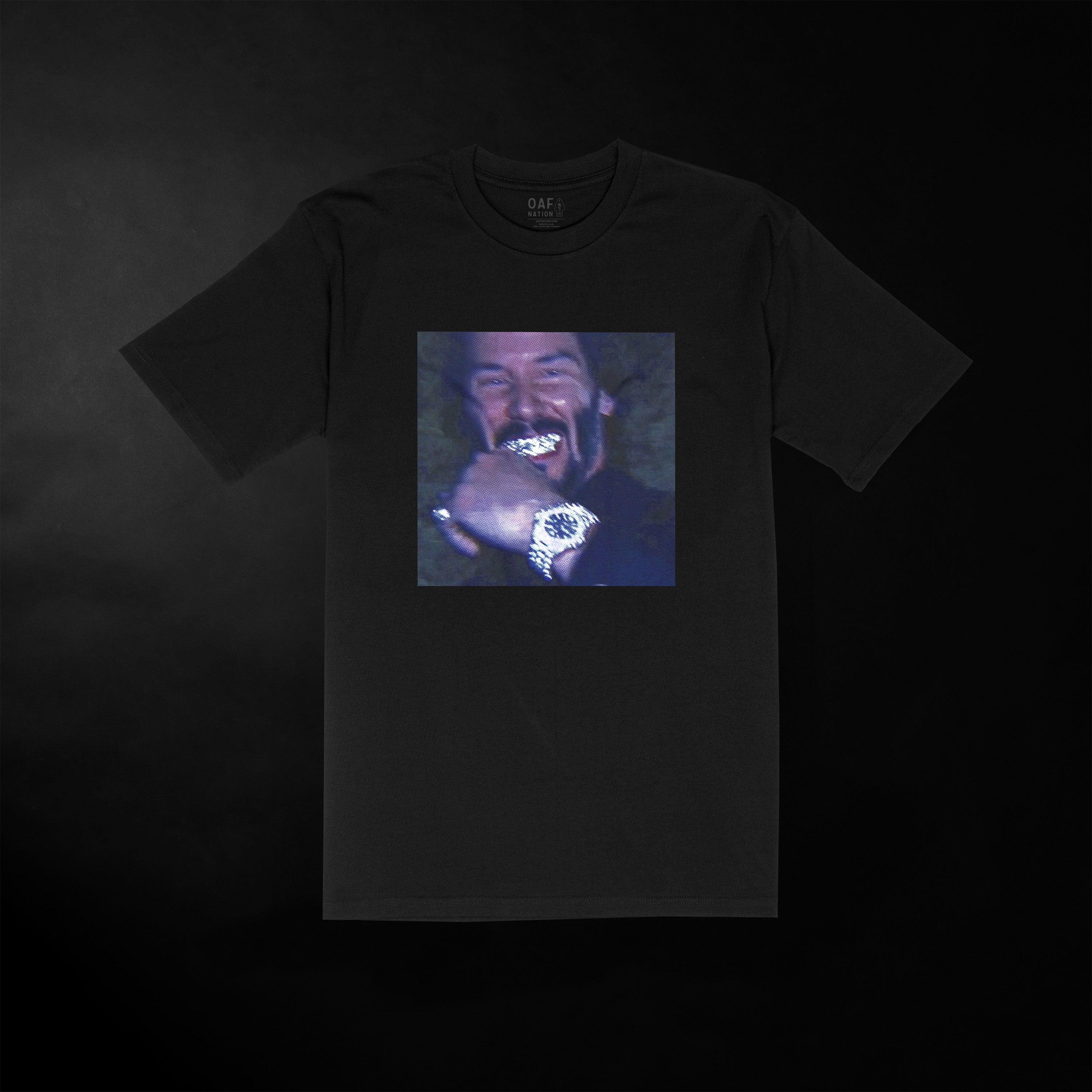 Black t-shirt with a graphic of a person with a necklace on a dark background
